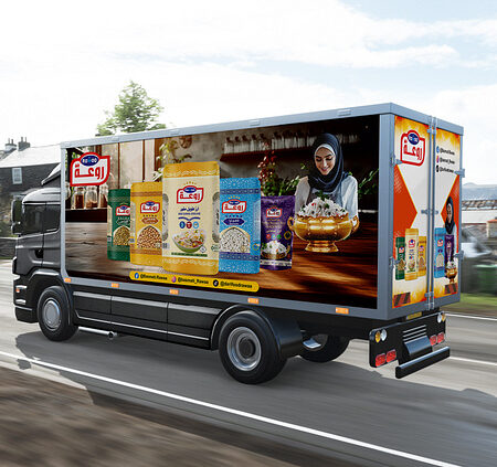 a branding truck moving on a road
